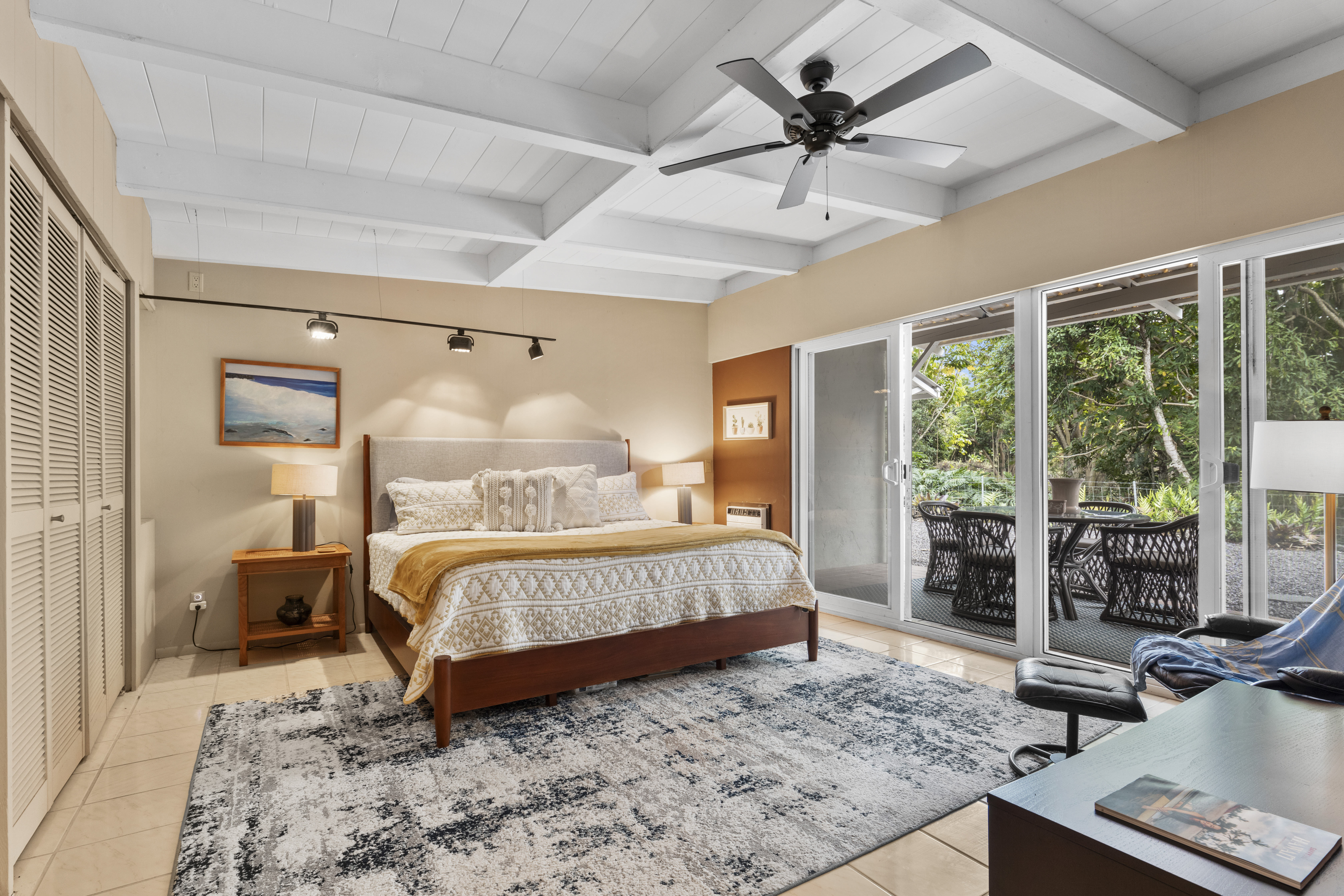 83-5369 Manako Road Captain Cook, HI 96704 - Photo 19 of 30 a bed sitting in a spacious bedroom next to a window