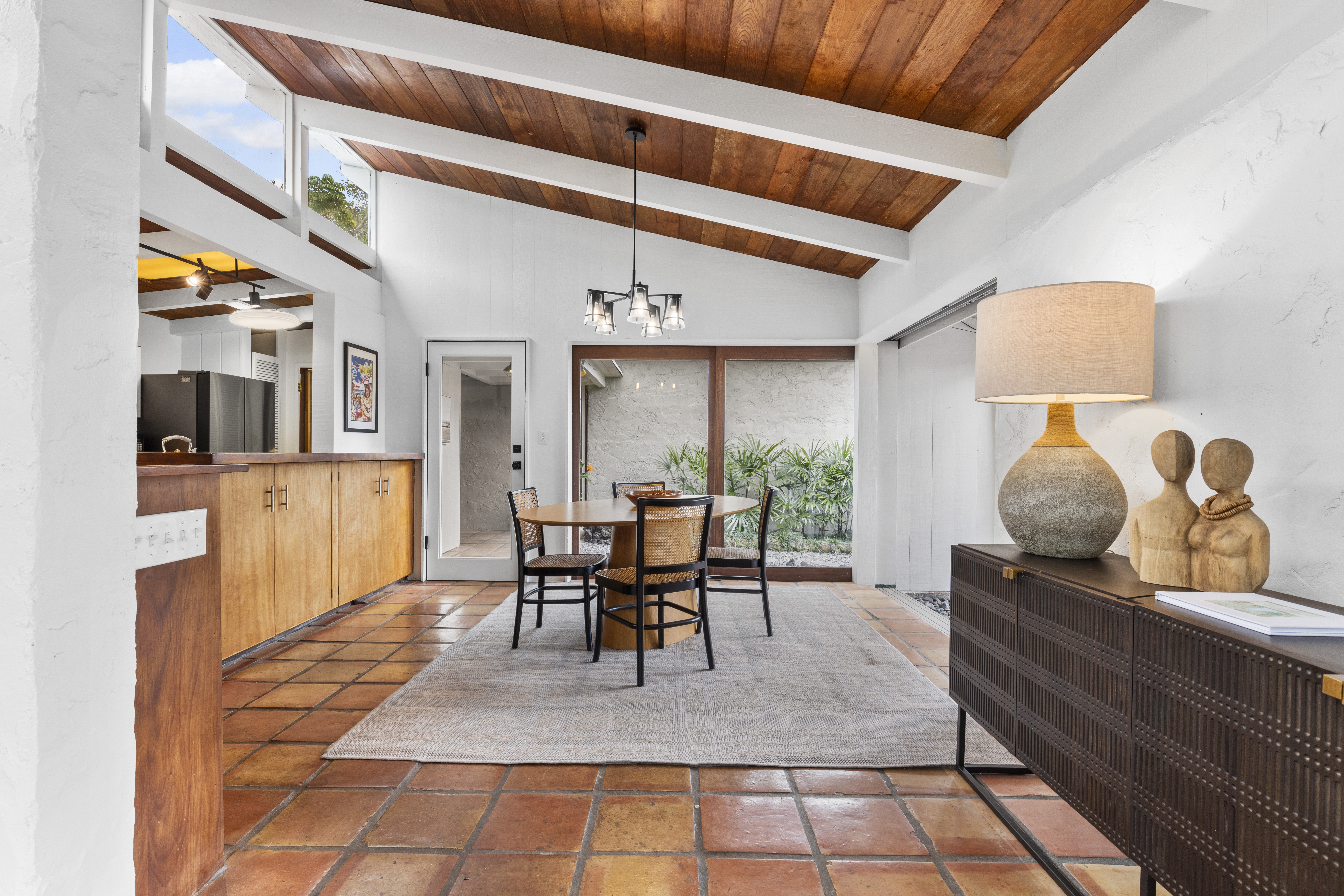 83-5369 Manako Road Captain Cook, HI 96704 - Photo 9 of 30 a dining room with furniture and a floor to ceiling window
