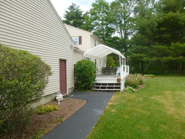 18 Phyllis Road Foxboro, MA 02035 - Photo 4 of 20 a front view of a house with garden