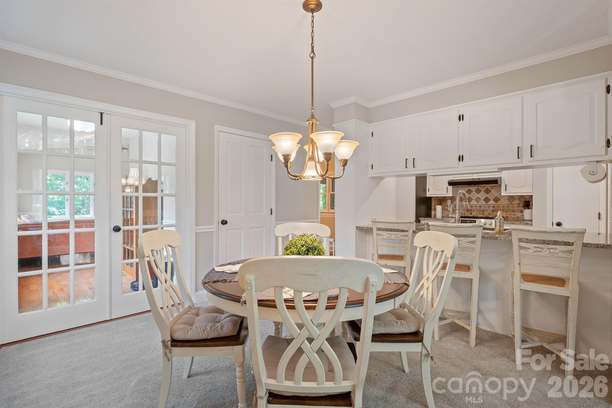 19017 Kailua Circle Tega Cay, SC 29708 - Photo 10 of 46 a view of a dining room with furniture window and wooden floor