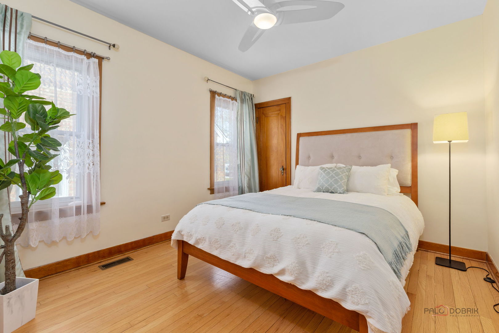 2720 Beulah Avenue River Grove, IL 60171 - Photo 15 of 33 a bedroom with a bed and a potted plant