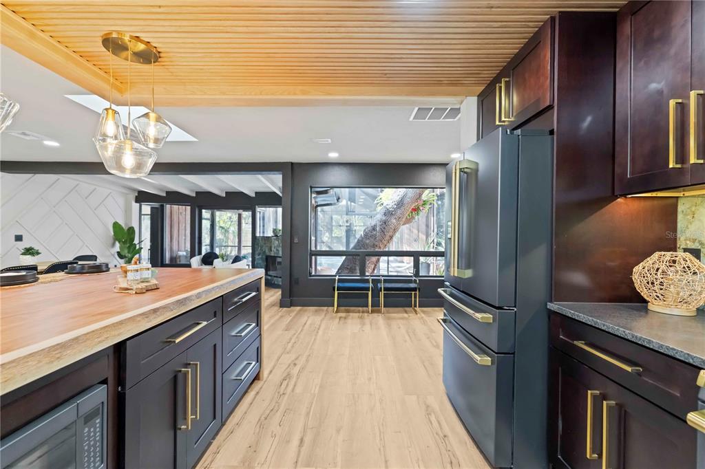 4534 Banan Place Siesta Key, FL 34242 - Photo 21 of 77 a kitchen with sink cabinets and outdoor space