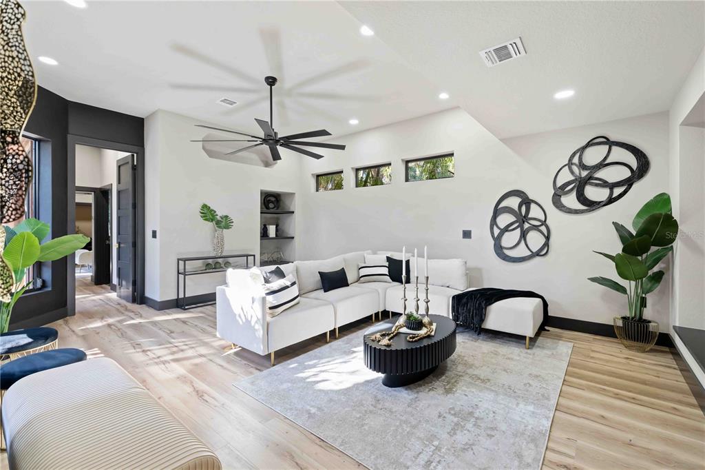 4534 Banan Place Siesta Key, FL 34242 - Photo 27 of 77 a living room with furniture a clock and a rug
