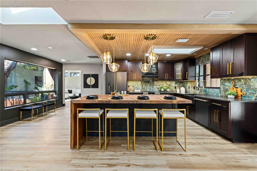 4534 Banan Place Siesta Key, FL 34242 - Photo 3 of 77 a kitchen with a table and chairs in it