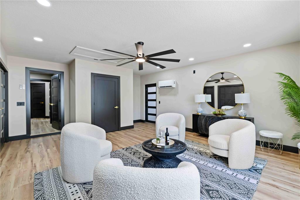 4534 Banan Place Siesta Key, FL 34242 - Photo 31 of 77 a living room with furniture and wooden floor