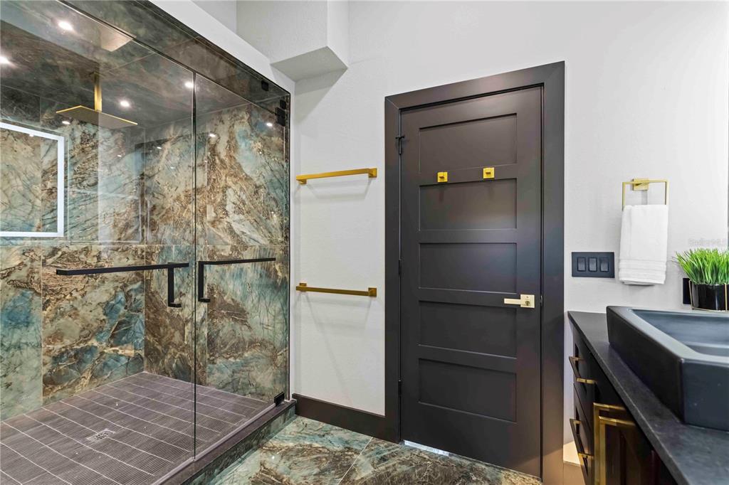 4534 Banan Place Siesta Key, FL 34242 - Photo 36 of 77 a bathroom with a shower