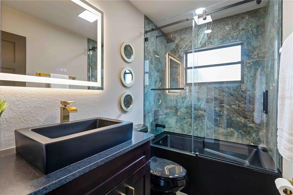 4534 Banan Place Siesta Key, FL 34242 - Photo 41 of 77 a bathroom with a sink and a bathtub