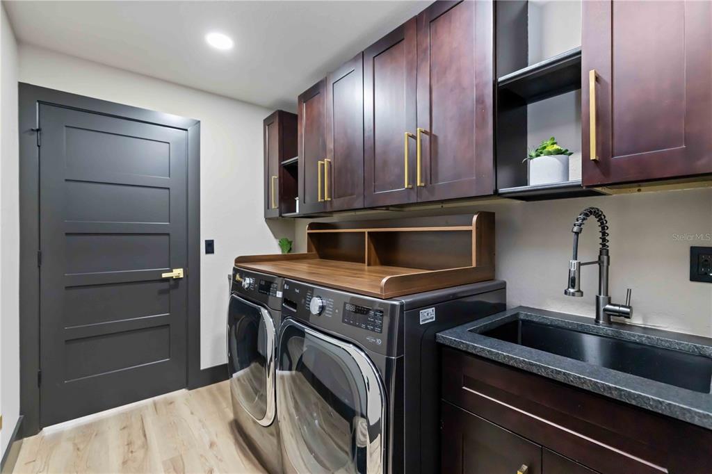 4534 Banan Place Siesta Key, FL 34242 - Photo 51 of 77 a kitchen with a stove and a sink