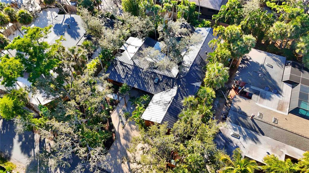 4534 Banan Place Siesta Key, FL 34242 - Photo 62 of 77 an aerial view of residential house with outdoor space and trees all around