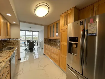 a view of a refrigerator in a kitchen