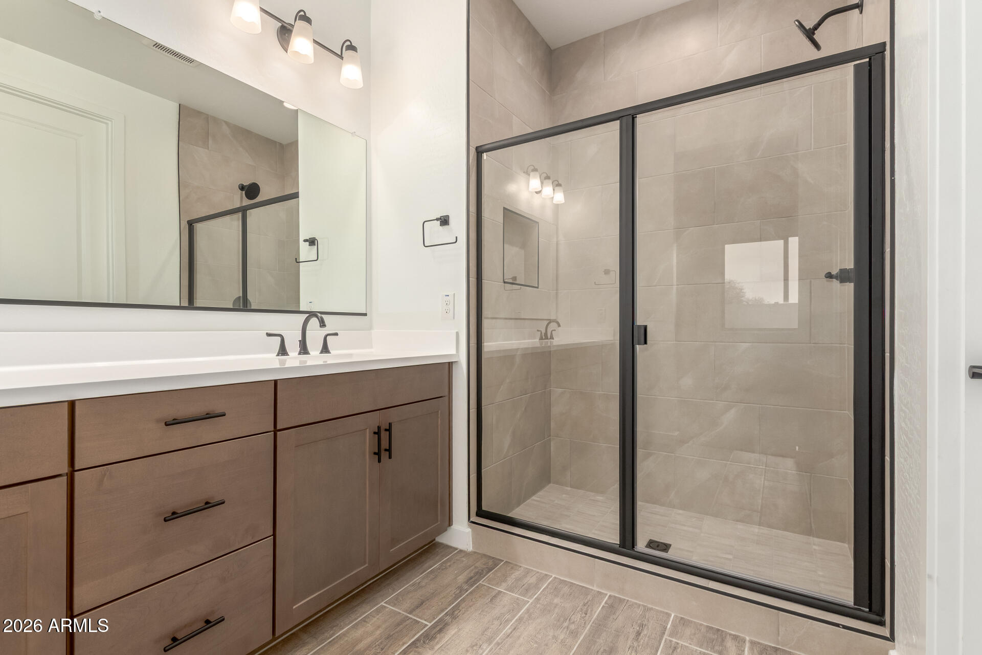 8030 West Granada Road Phoenix, AZ 85035 - Photo 13 of 36 a bathroom with a shower sink and mirror