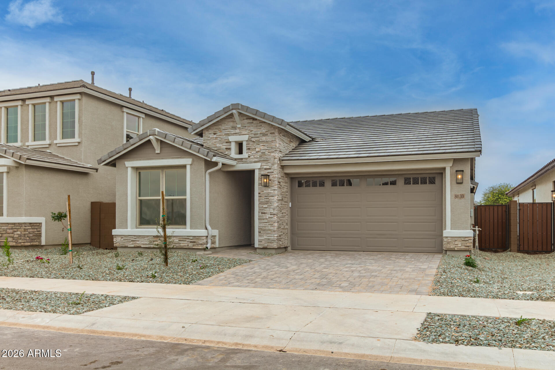 8030 West Granada Road Phoenix, AZ 85035 - Photo 23 of 36 a front view of a house with a garage