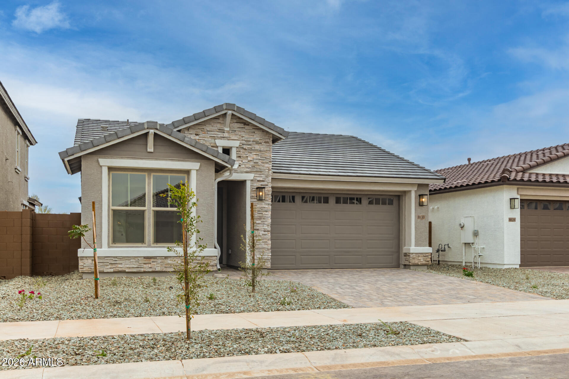 8030 West Granada Road Phoenix, AZ 85035 - Photo 25 of 36 a front view of a house with a yard and garage