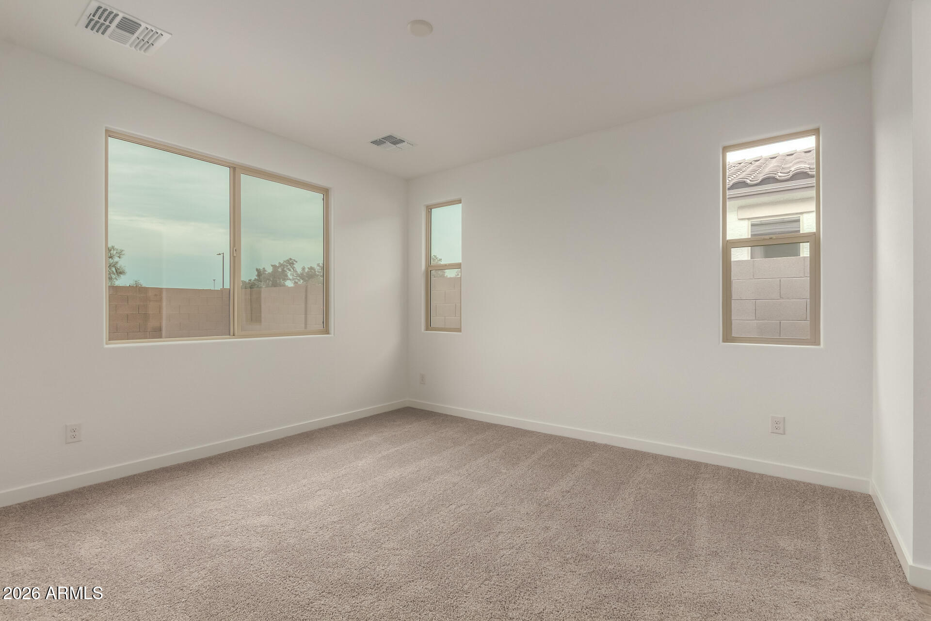 8030 West Granada Road Phoenix, AZ 85035 - Photo 9 of 36 an empty room with windows