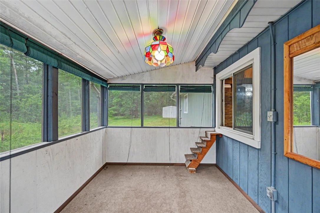 3331 Aspen Road Kunkletown, PA 18058 - Photo 41 of 50 The Screened Porch has it's own entrance and features indoor/outdoor carpets, a vaulted ceiling and a chandelier.