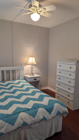 a bedroom with a bed and a lamp