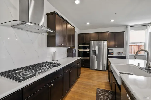 a kitchen with a sink and refrigerator