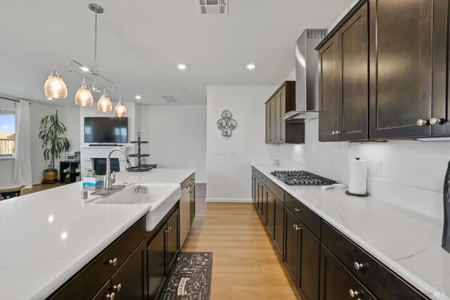a kitchen with stainless steel appliances granite countertop a stove and a refrigerator