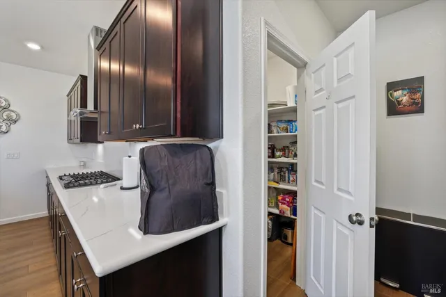 a bedroom with a bed and a flat tv screen on the dresser