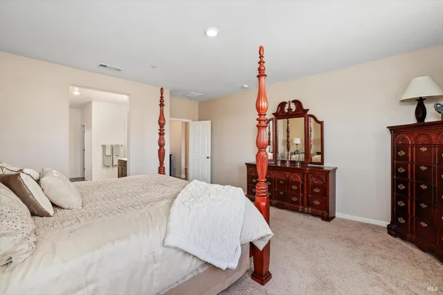 a bathroom with a sink vanity granite and a mirror