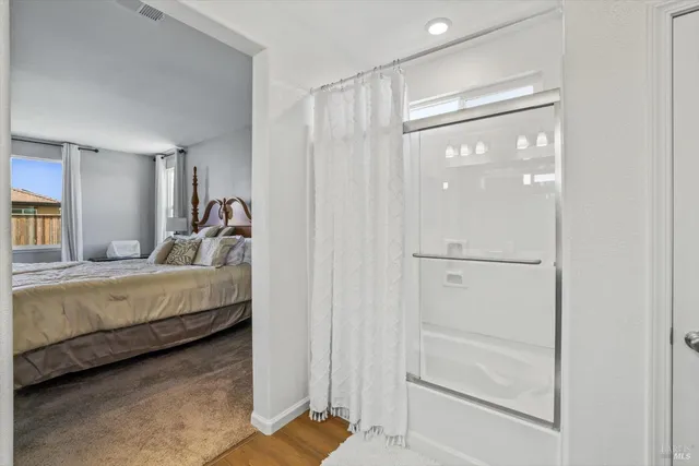 a white toilet sitting next to a bathroom sink