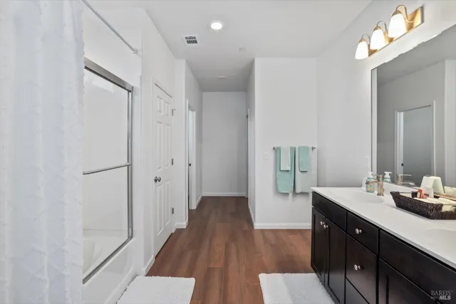 a view of walk in closet with clothes