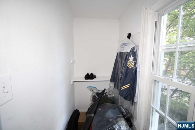 323 Maple Avenue, Unit 2 Oradell, NJ 07649 - Photo 5 of 8 a view of a hallway with furniture and a window