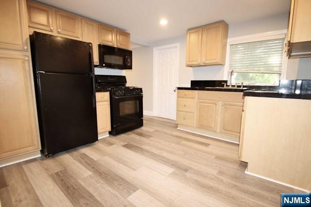 323 Maple Avenue, Unit 2 Oradell, NJ 07649 - Photo 7 of 8 a kitchen with a refrigerator and a stove top oven