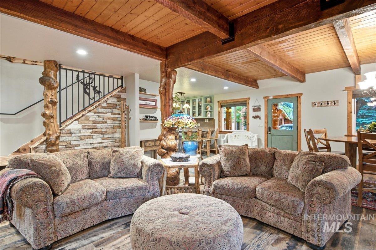1029 Cee Way Loop McCall, ID 83638 - Photo 13 of 50 Wood-finish flooring with exposed wood beam ceiling
