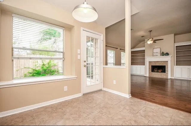 a view of a livingroom with furniture window and wooden floor