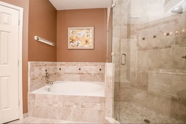 a bathroom with a sink a mirror and a shower