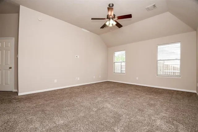 a bathroom with a white bath tub a toilet and a sink