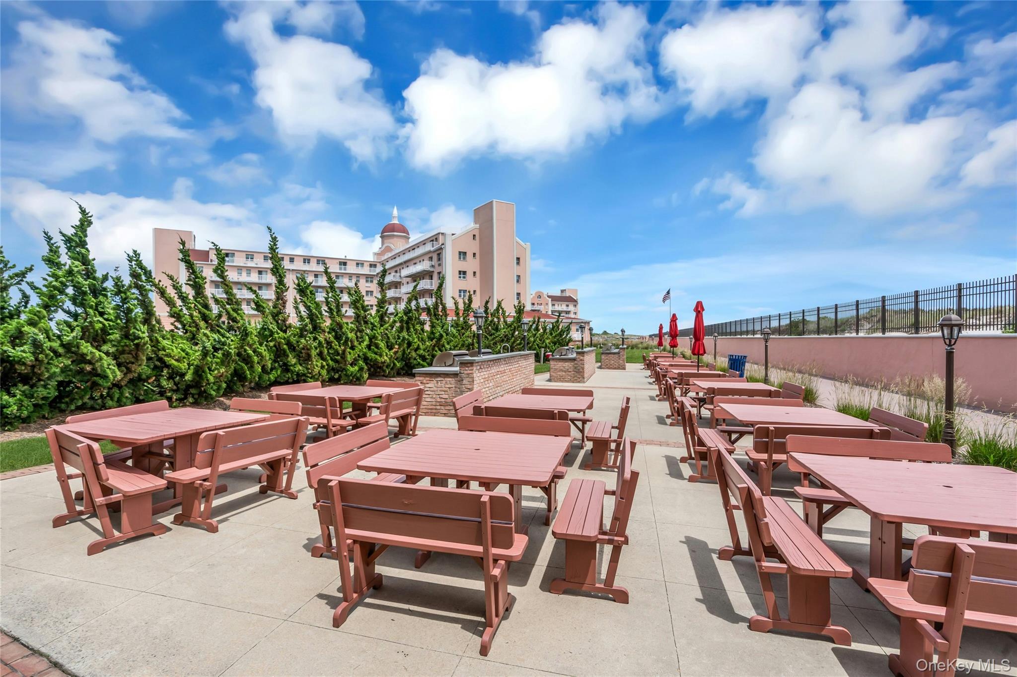 2 Richmond Road, Unit 5W Lido Beach, NY 11561 - Photo 19 of 42 OUTDOOR DINING...Equipd with multiple grills, tables and chairs ideal for mingling, grilling, flanking the ocean