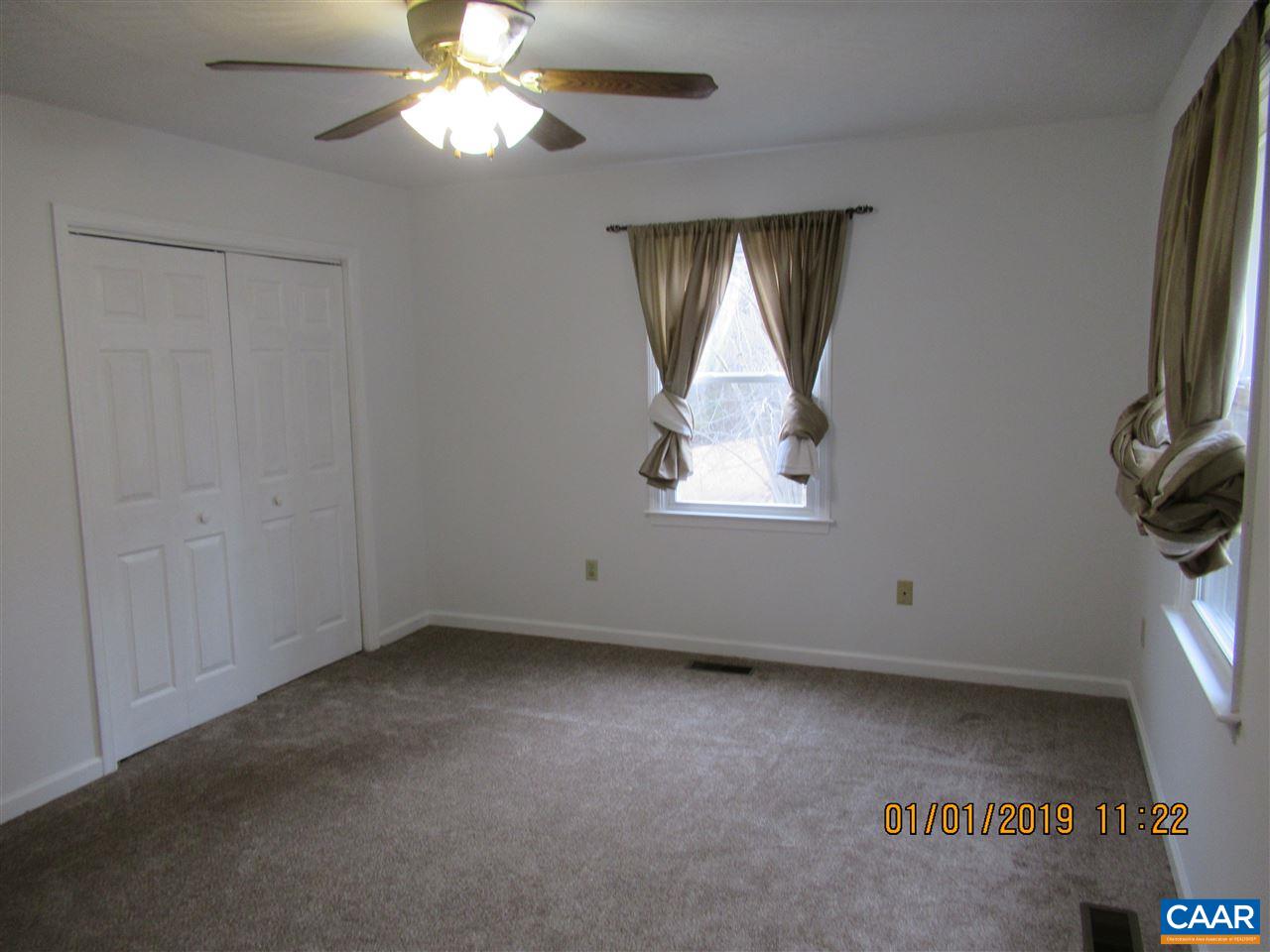 347 West Daffodil Road Ruckersville, VA 22968 - Photo 8 of 17 an empty room with a window and a ceiling fan
