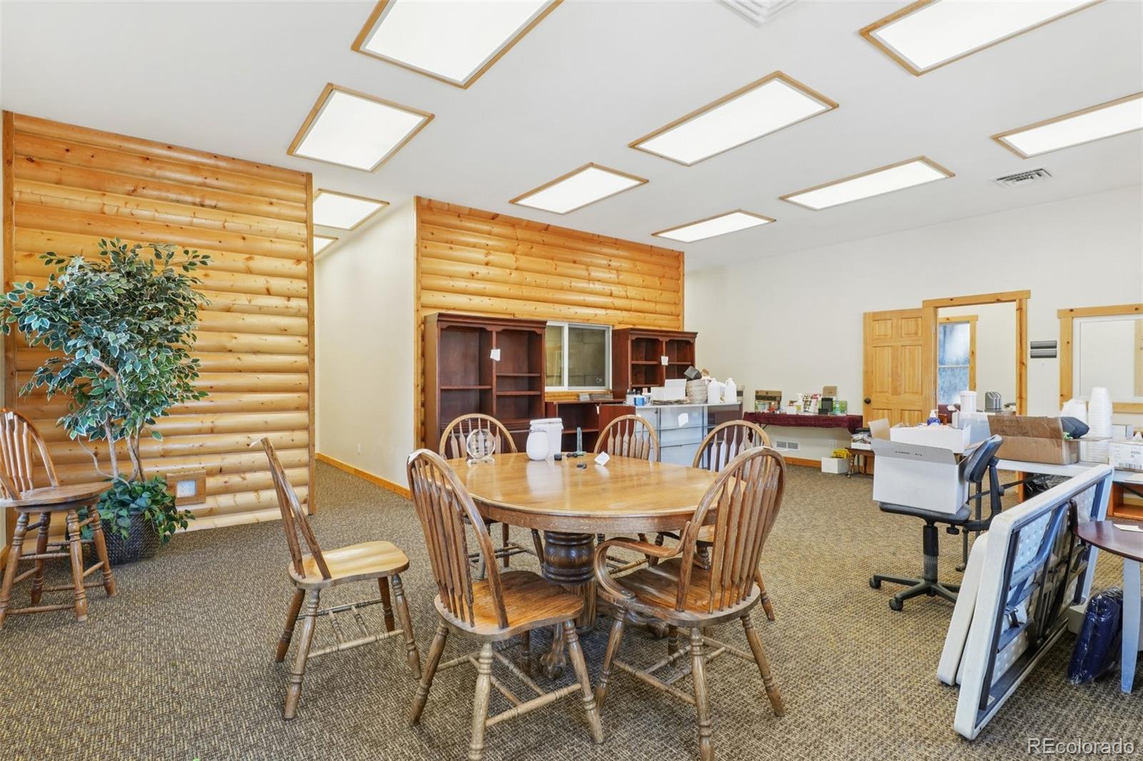 4628 Smith Hill Road Golden, CO 80403 - Photo 14 of 49 a dining room with furniture and wooden floor