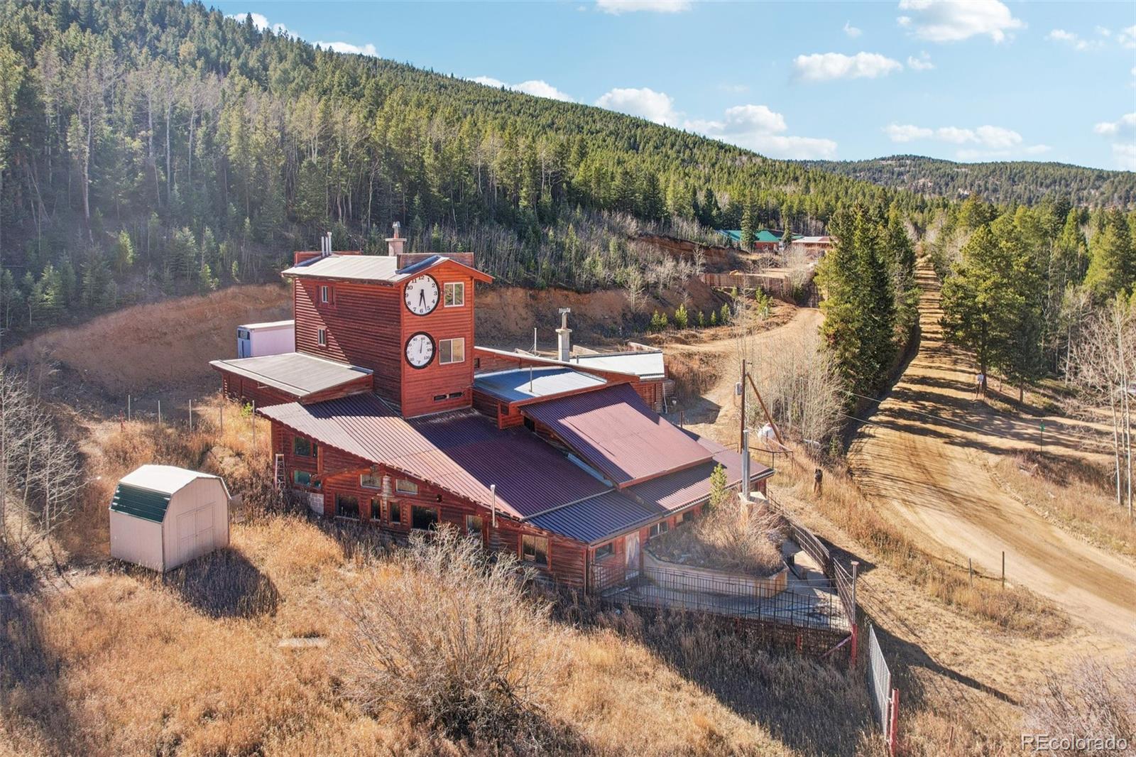 4628 Smith Hill Road Golden, CO 80403 - Photo 2 of 49 a view of a chairs and table on the terrace