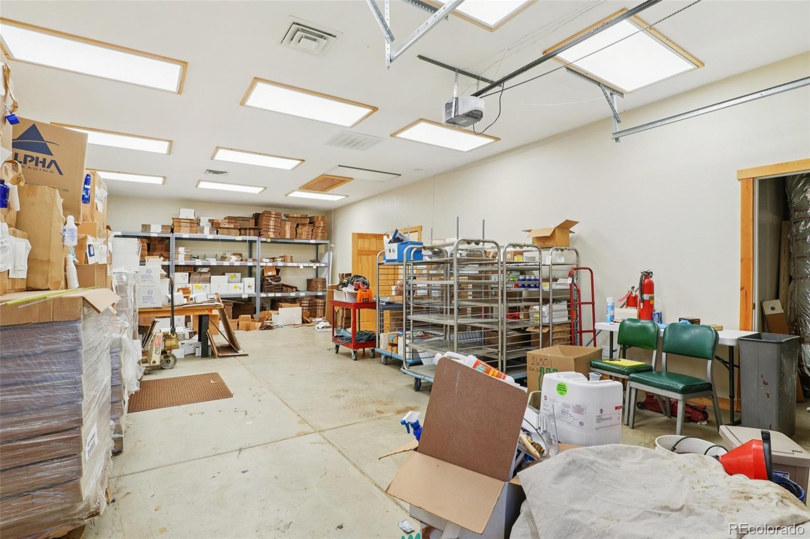 4628 Smith Hill Road Golden, CO 80403 - Photo 21 of 49 a room with lots of furniture and clutter