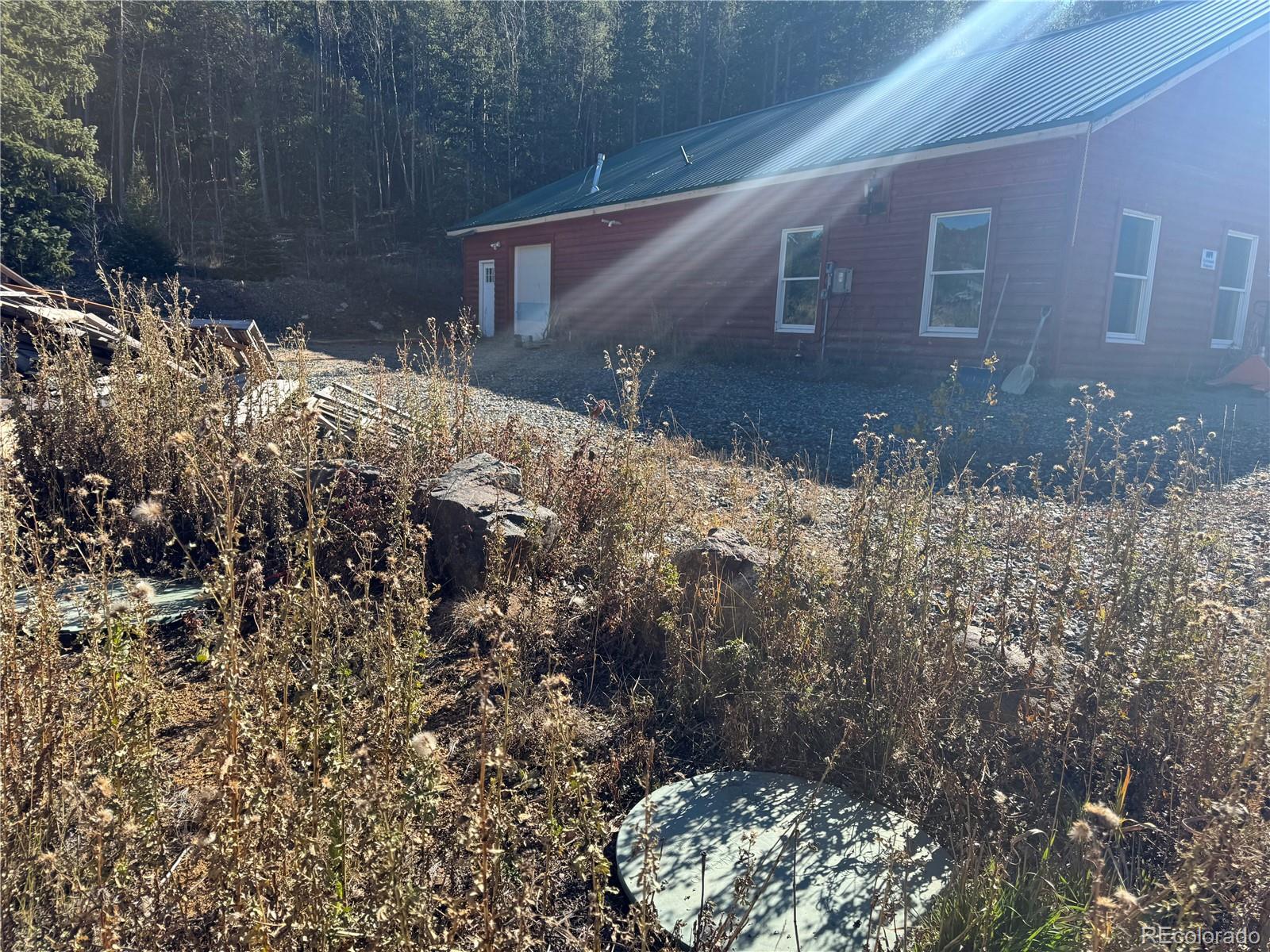 4628 Smith Hill Road Golden, CO 80403 - Photo 23 of 49 a front view of house with yard