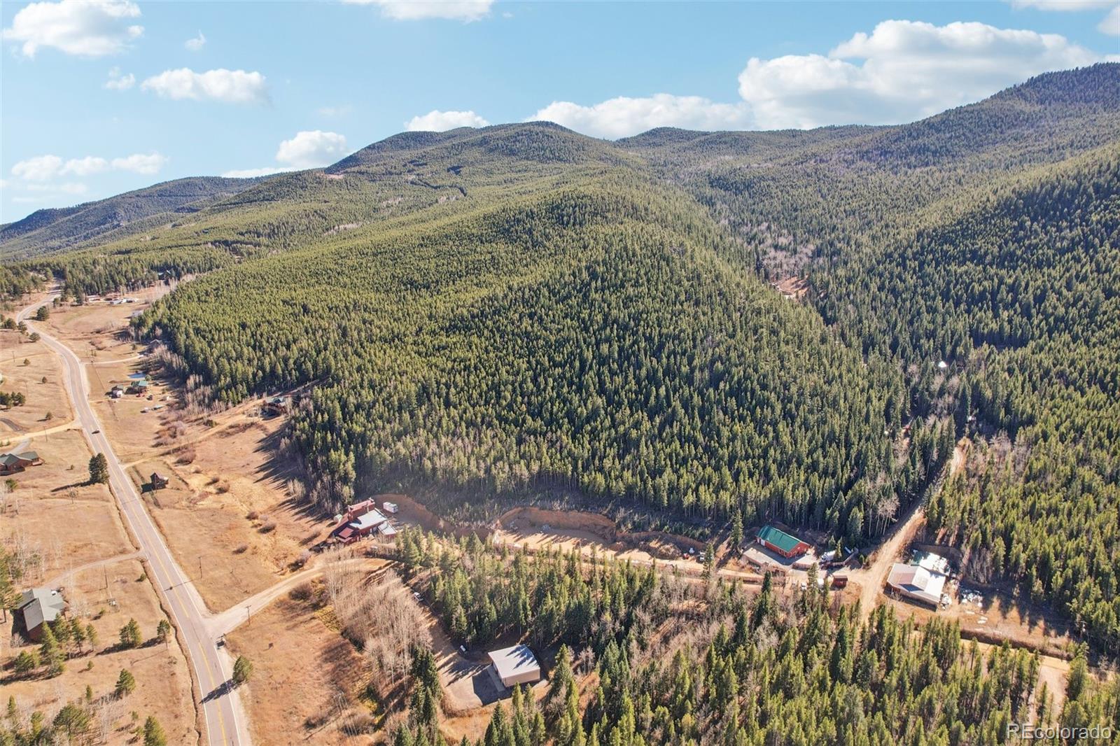 4628 Smith Hill Road Golden, CO 80403 - Photo 30 of 49 a view of a dry yard with mountains