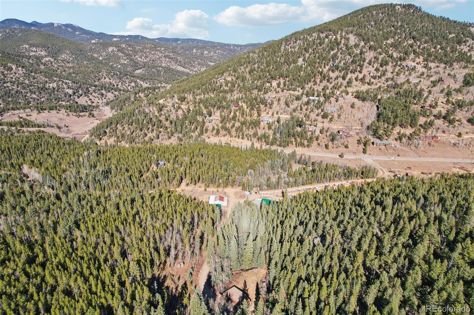 4628 Smith Hill Road Golden, CO 80403 - Photo 32 of 49 a view of residential houses with yard and mountain view in back