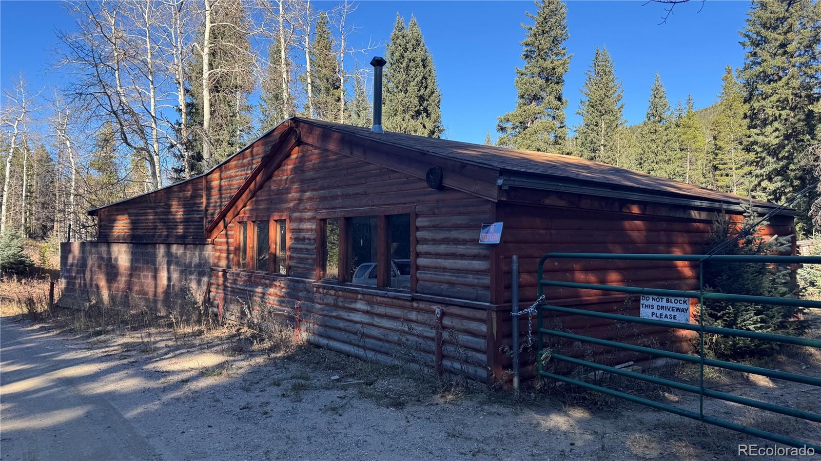4628 Smith Hill Road Golden, CO 80403 - Photo 35 of 49 a front view of a house with a yard