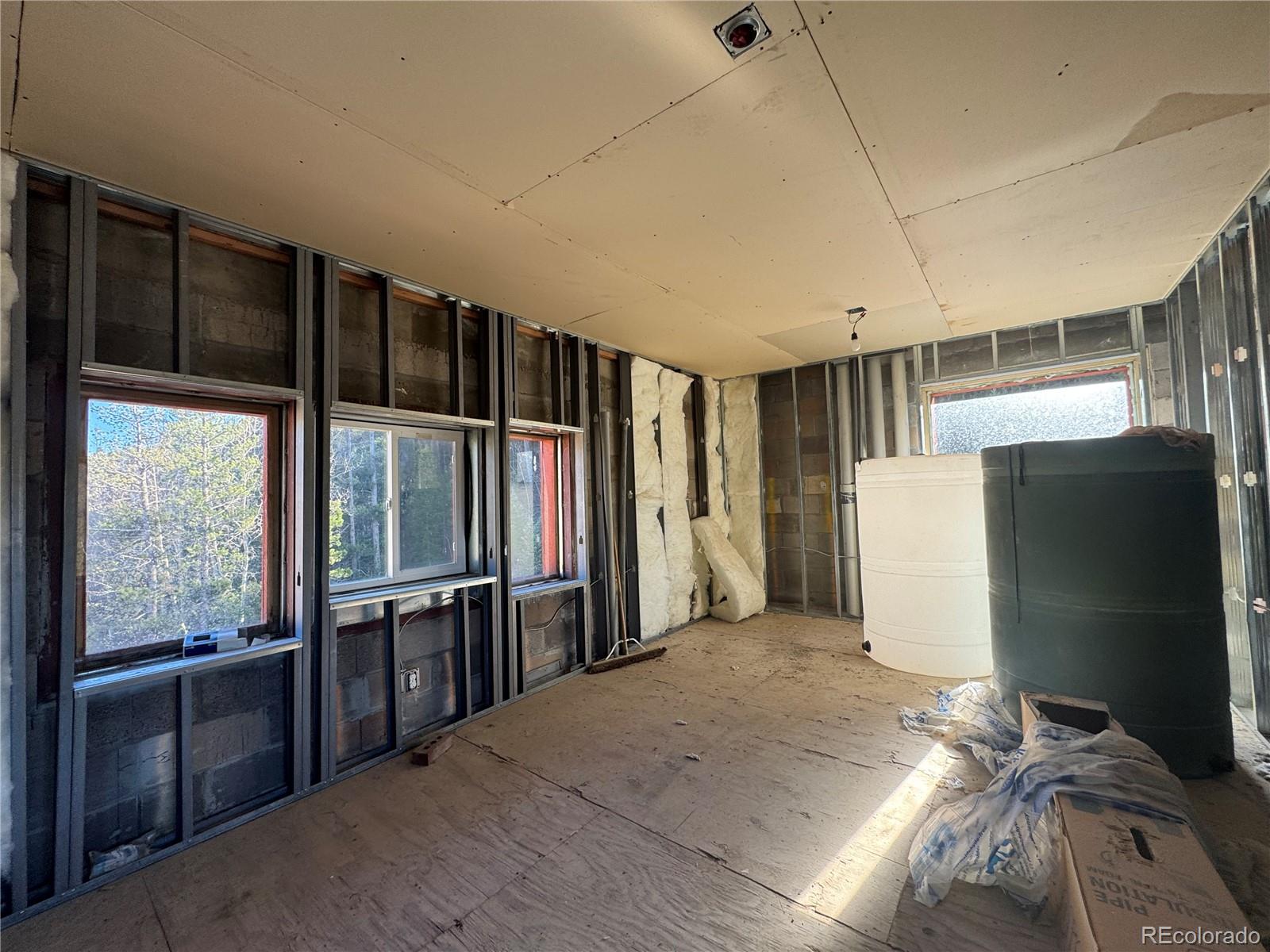 4628 Smith Hill Road Golden, CO 80403 - Photo 39 of 49 a view of empty room with a kitchen