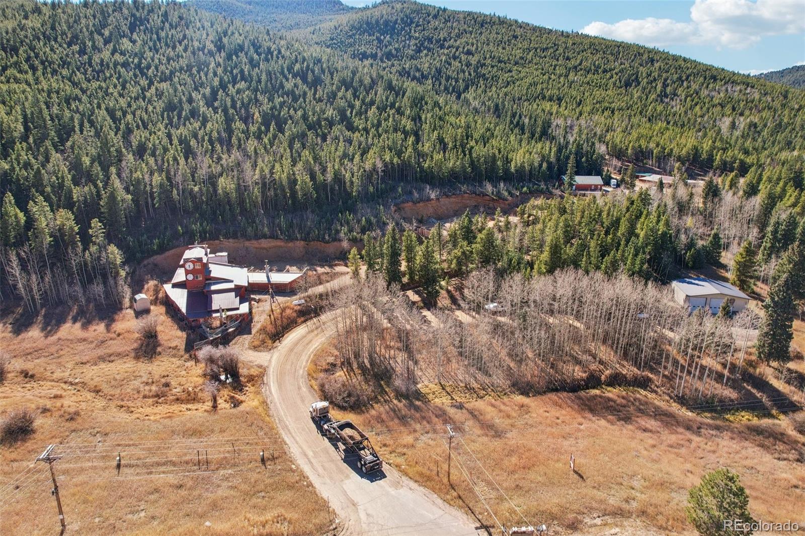 4628 Smith Hill Road Golden, CO 80403 - Photo 4 of 49 a view of a chairs and table in the patio