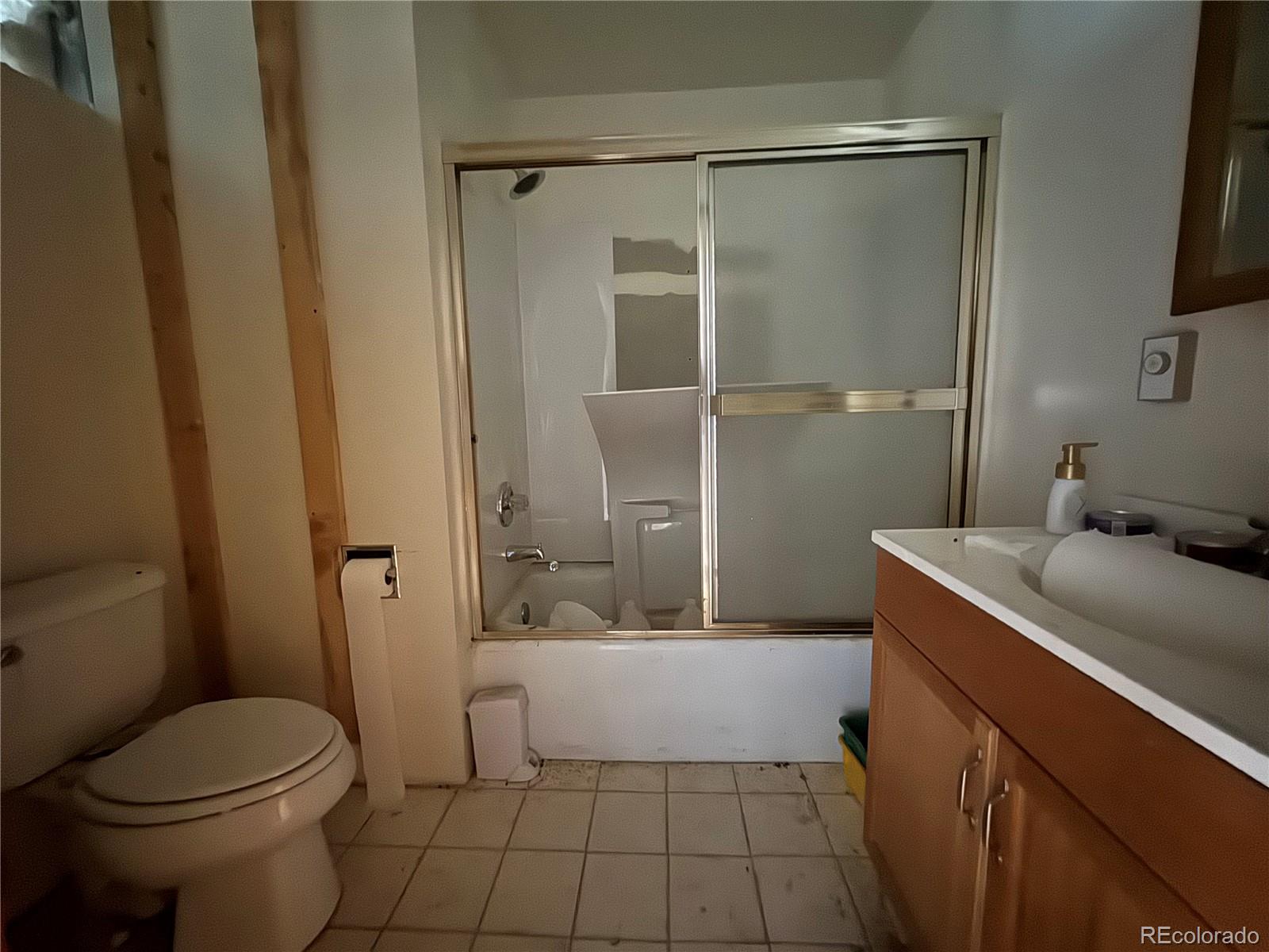 4628 Smith Hill Road Golden, CO 80403 - Photo 43 of 49 a bathroom with a sink a toilet and shower