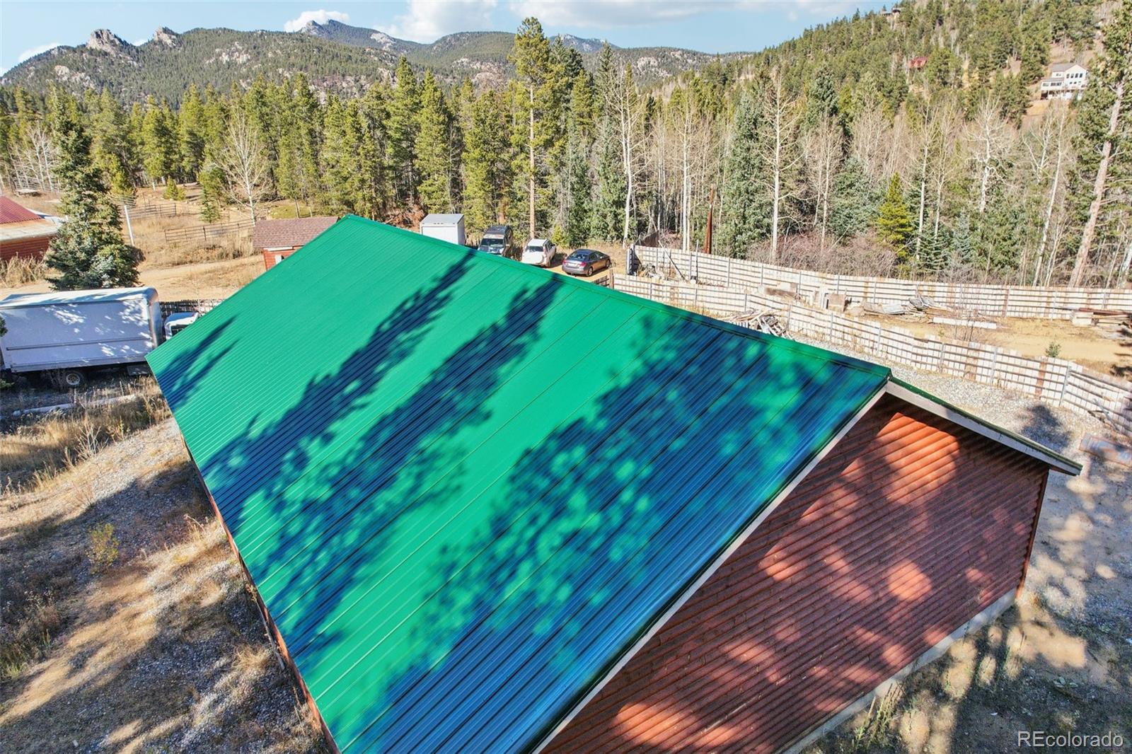 4628 Smith Hill Road Golden, CO 80403 - Photo 8 of 49 a view of a lush green space with sea