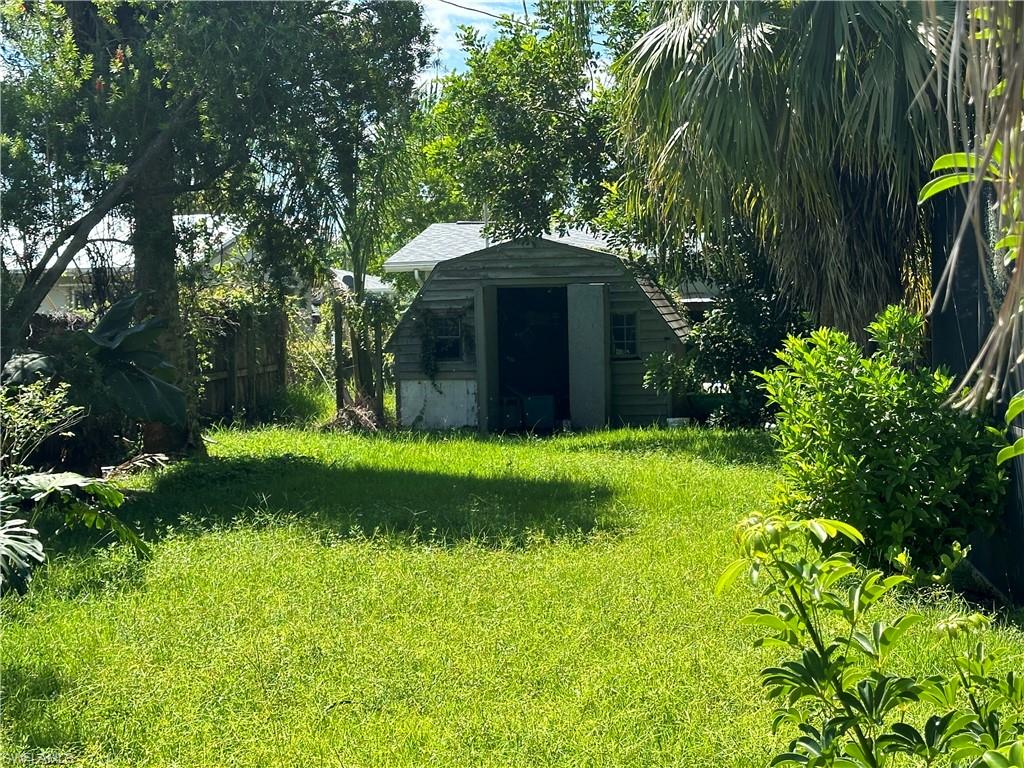 1132 Donald Road North Fort Myers, FL 33917 - Photo 7 of 21 a view of a yard with plants and large trees