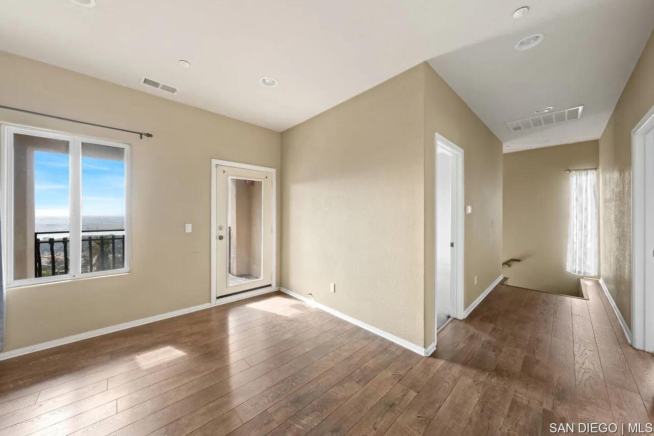 9648 Eucalyptus Street Spring Valley, CA 91977 - Photo 21 of 39 wooden floor in an empty room with a window