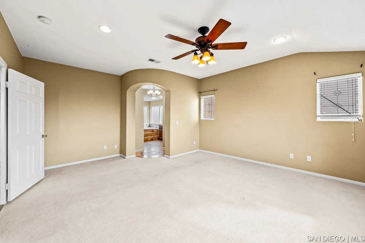 9648 Eucalyptus Street Spring Valley, CA 91977 - Photo 27 of 39 a view of a livingroom with a ceiling fan and window