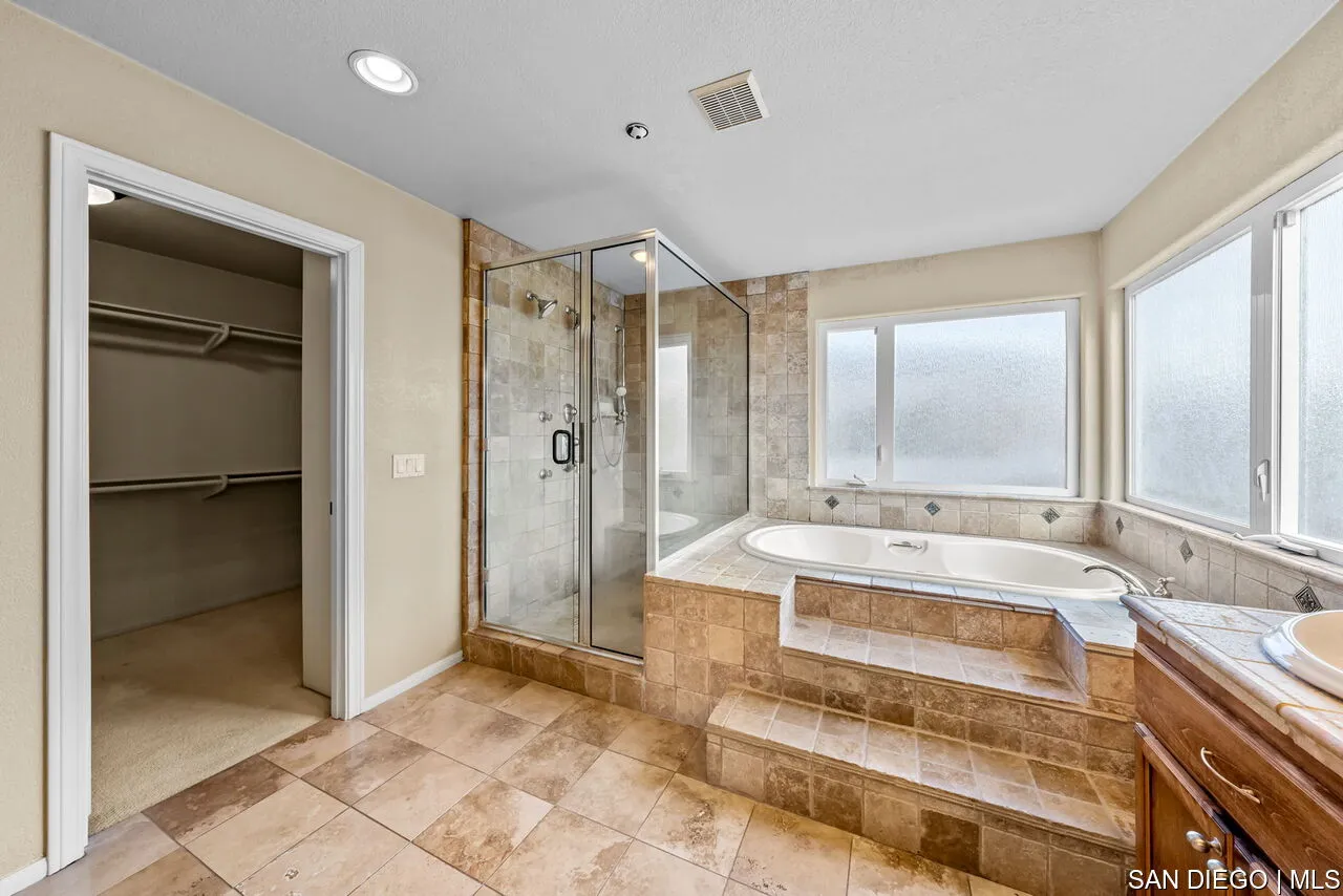 9648 Eucalyptus Street Spring Valley, CA 91977 - Photo 29 of 39 a spacious bathroom with a tub shower and sink