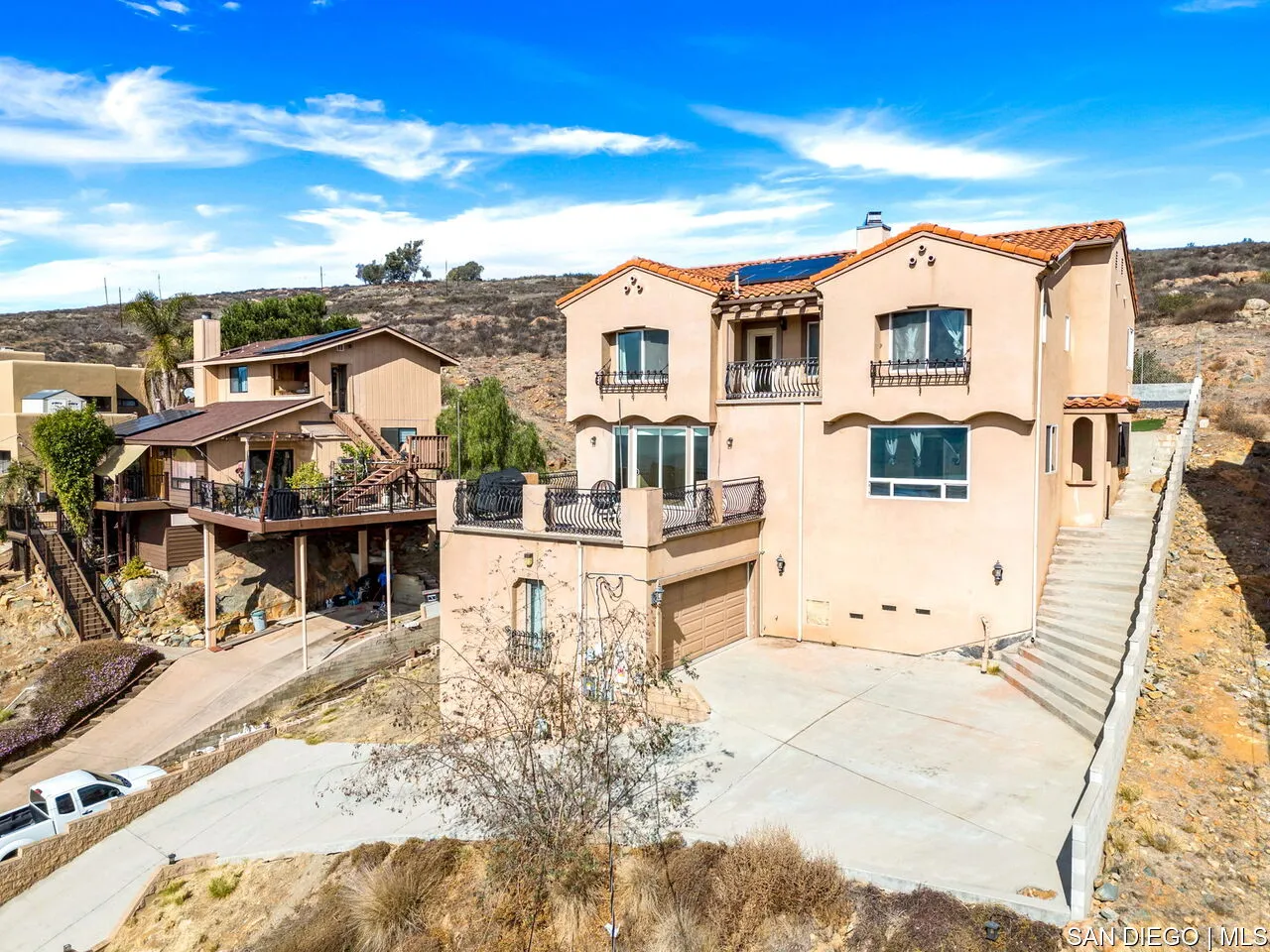 9648 Eucalyptus Street Spring Valley, CA 91977 - Photo 3 of 39 a view of a white building with many windows